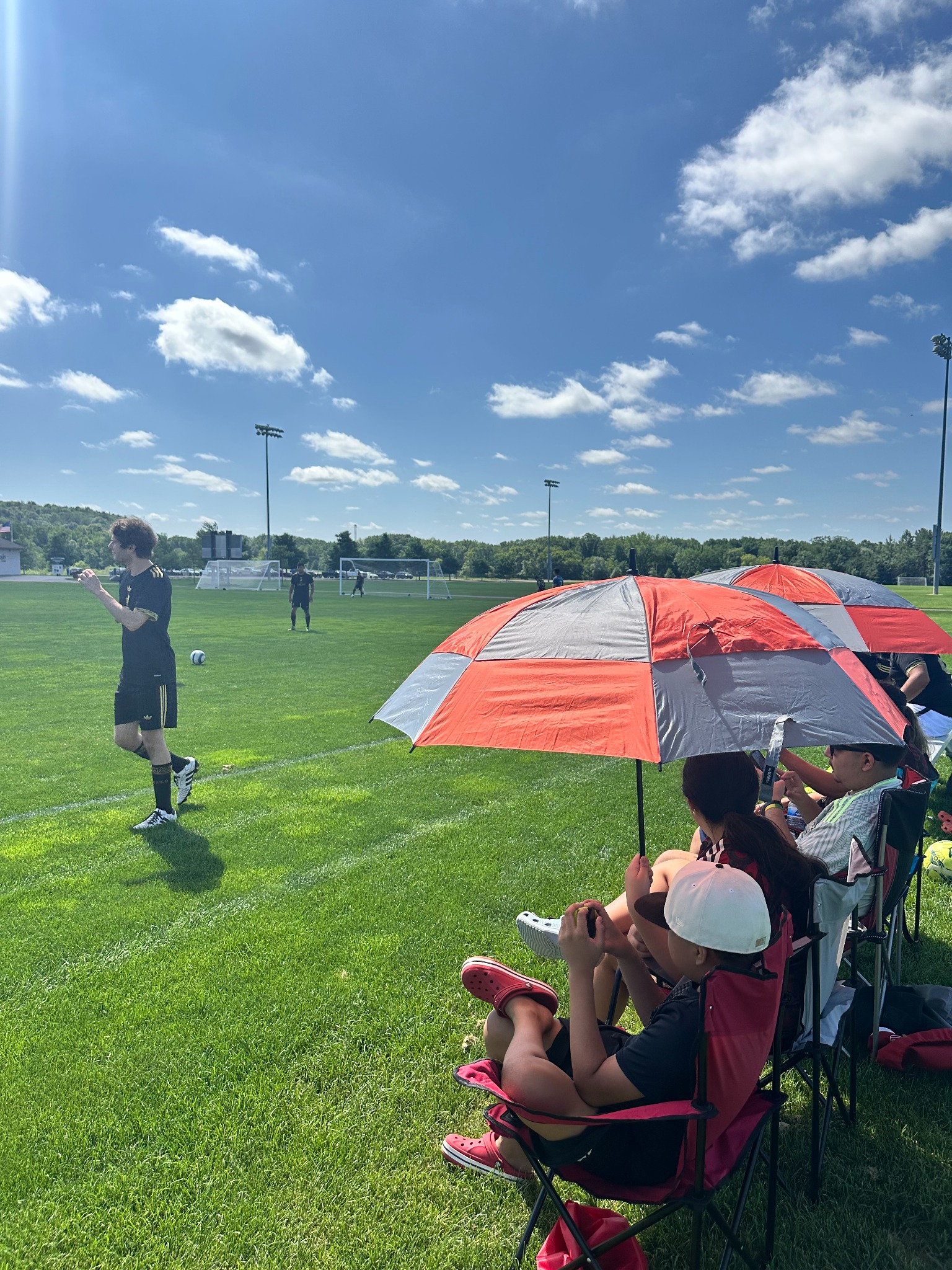 Players under umbrella